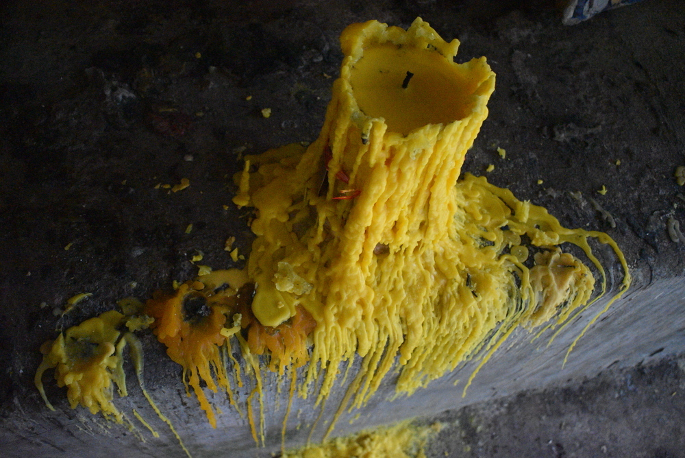 Yellow candle wax symbolizes the enlightenment of the Buddha.